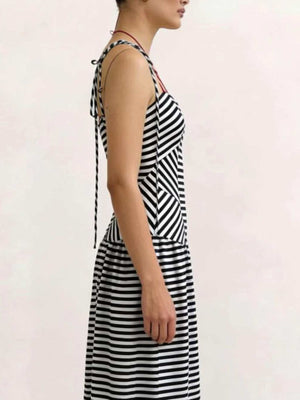 Maxi dress with black and white chevron stripes, V-neck, and tie straps.