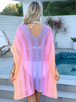 Ombre crochet kaftan cover-up with V-neck and open knit pattern in pink, purple, and orange hues.