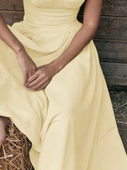 Pastel yellow sweetheart midi dress with spaghetti straps and ruched waist