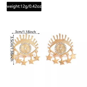 Gold evil eye dangle earrings with star charms, 18K gold-plated.