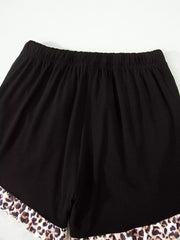 Black pajama shorts with elastic waist and leopard print ruffle trim