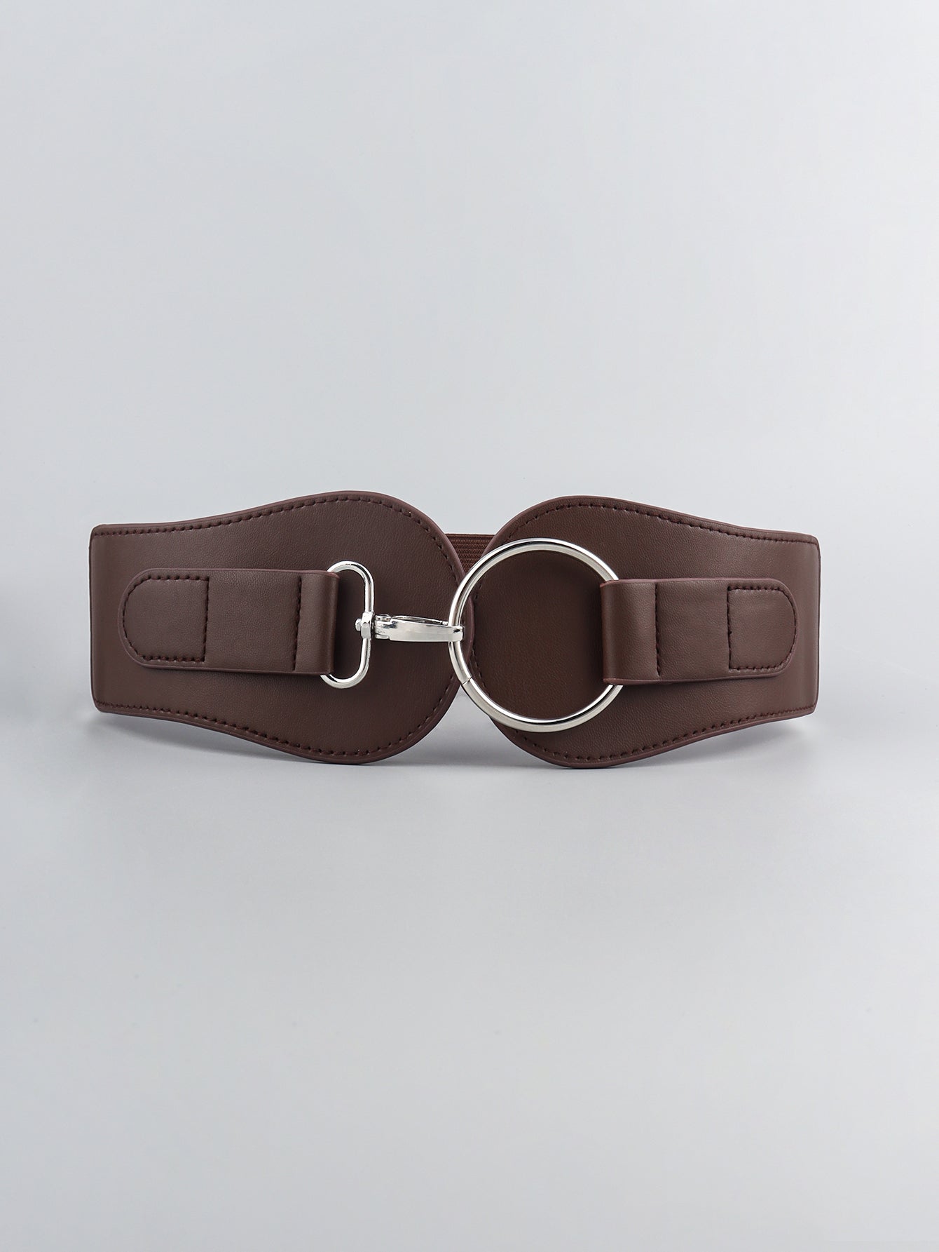 Brown cincher belt with a silver ring buckle and elastic back for a cinched waist