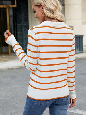 Polo-neck knit top with orange and white Breton stripes, long sleeves, and ribbed cuffs and hem.