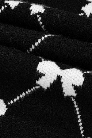 Black knit vest with white diamond bow pattern