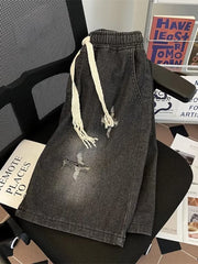 Black distressed denim shorts for men with drawstring and frayed details.
