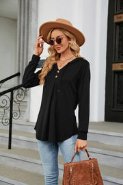 Black hooded henley top with button detail and pleats
