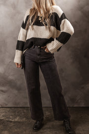 Black and cream striped relaxed fit knit sweater with ribbed cuffs and crew neck.