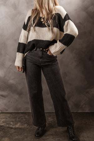 Black and cream striped relaxed fit knit sweater with ribbed cuffs and crew neck.