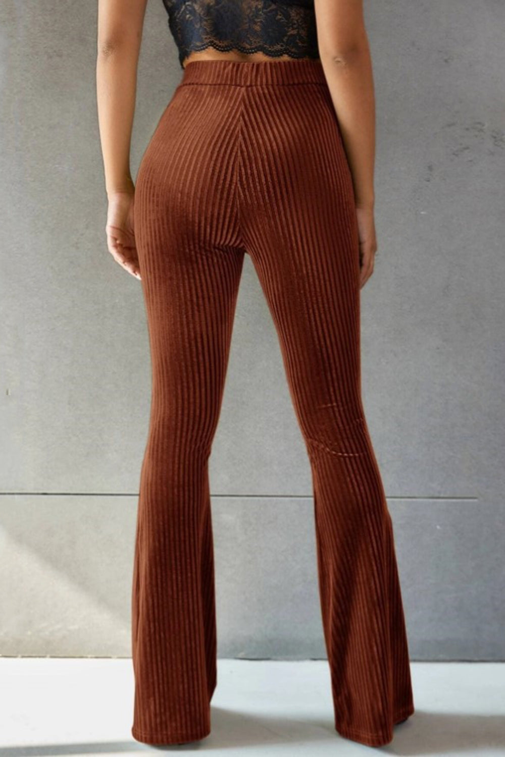 Brown ribbed velvet palazzo trousers with a flared leg