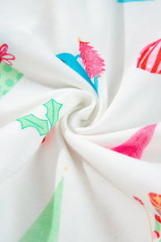 White cotton pajama fabric with a festive holiday print of gifts and trees.
