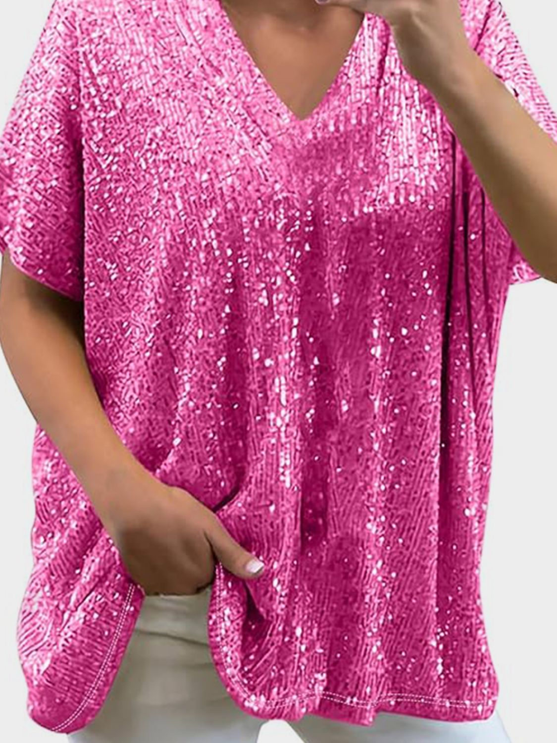 Pink sequin slouchy V-neck blouse with short sleeves and a relaxed fit.