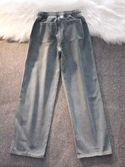 Blue vintage wash wide-leg jeans with drawstring waist and back pockets.