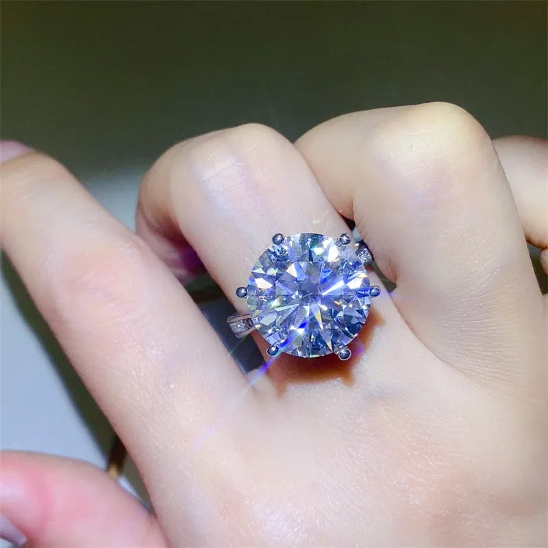 Solitaire Prism Ring in silver with a large, brilliant-cut clear stone and small accent stones on the band.