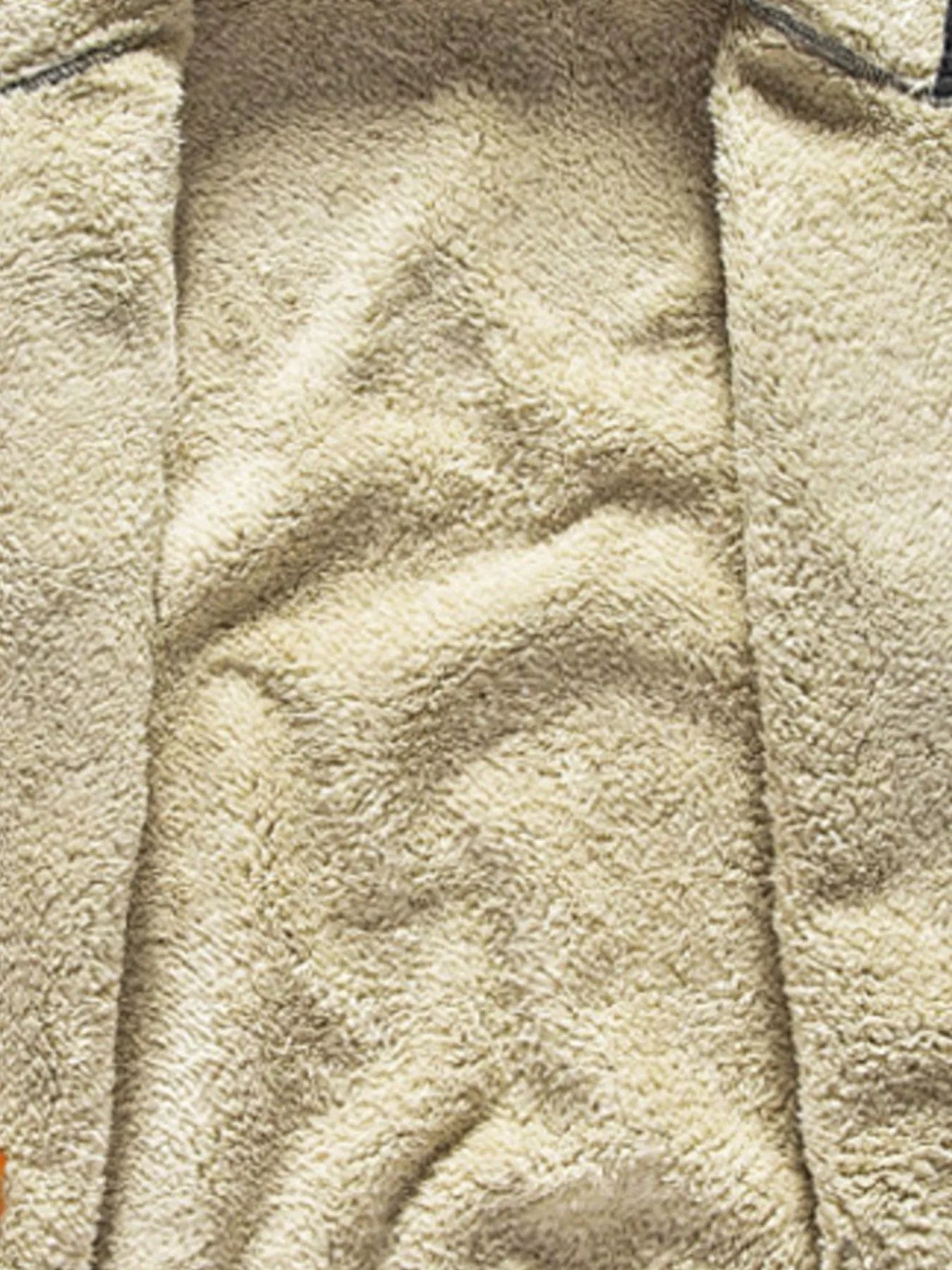 Men's black zip-up hoodie with plush fleece lining detail