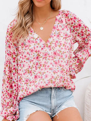 Maternity floral print V-neck long sleeve shirt in pink with billowy sleeves.