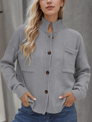 Gray acrylic knit cardigan with stand collar, button front, and two chest pockets.