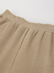 Beige ribbed knit pants with elastic waistband detail