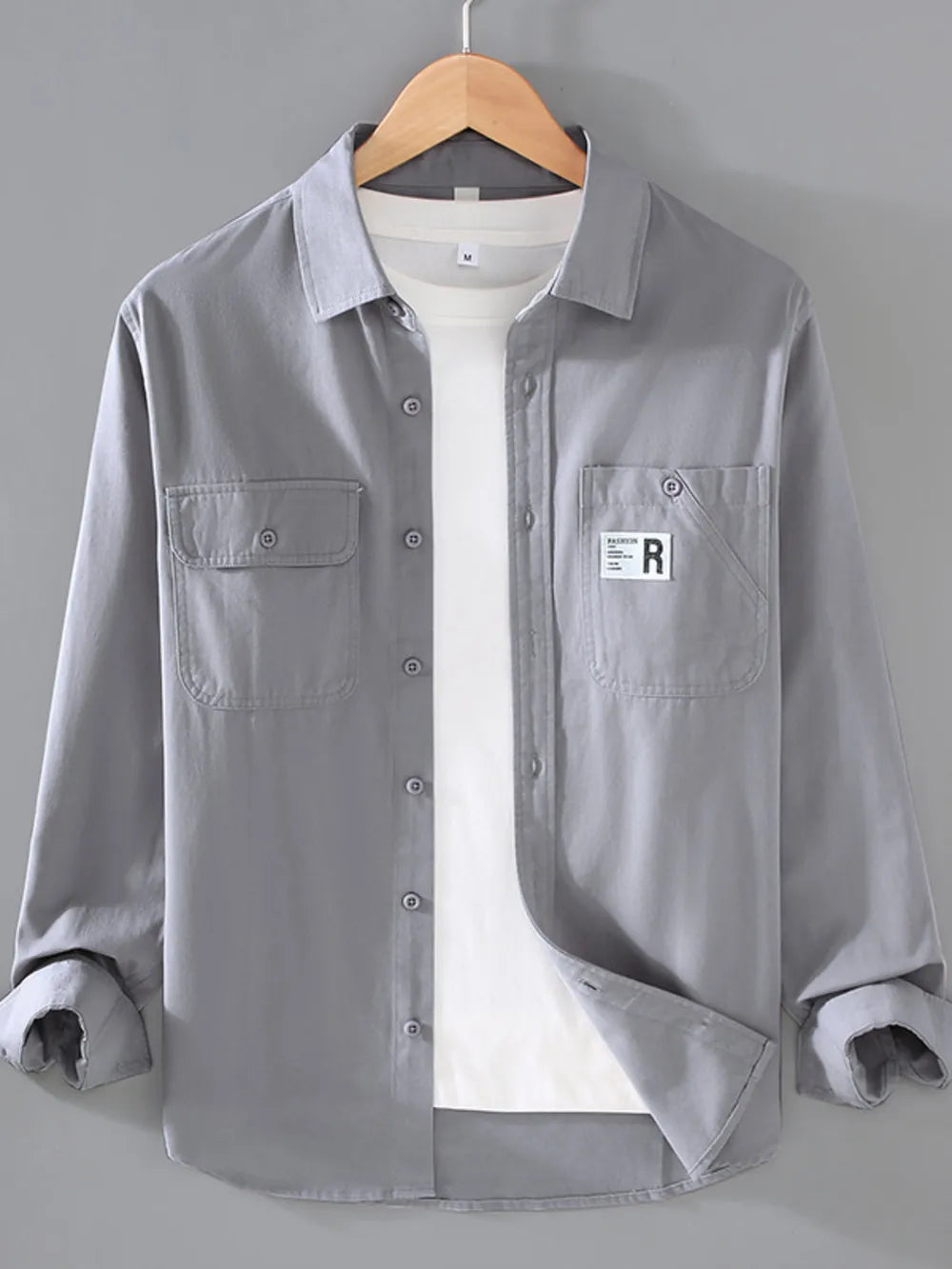 Light Gray cotton long-sleeve overshirt with buttoned chest pockets and a white t-shirt underneath.