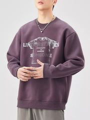 Men's oversized purple graphic sweatshirt with crewneck and long sleeves.