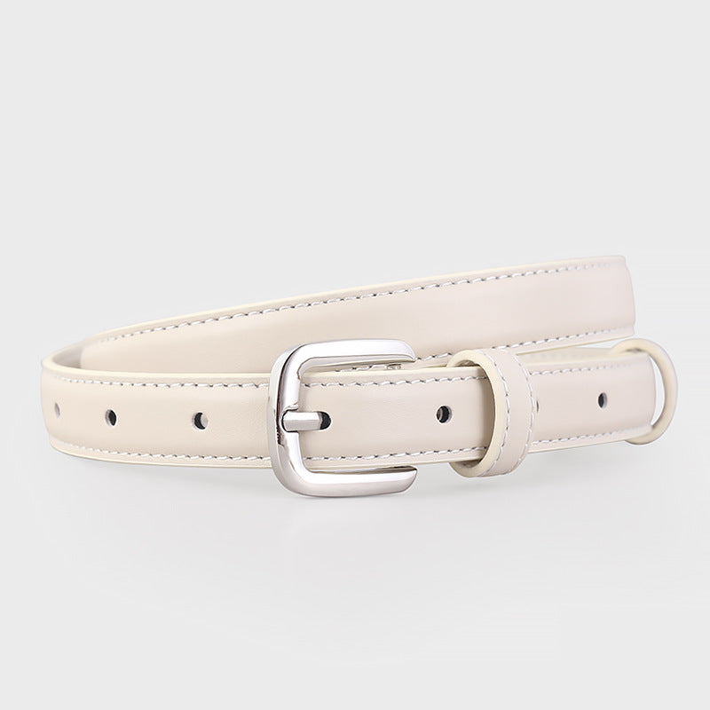 Timeless skinny belt in ivory cowhide leather with silver buckle and keeper loop.