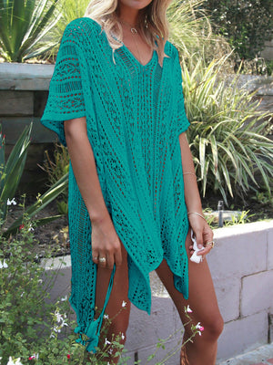 Teal open-knit V-neck beach cover-up with short sleeves and tassel details.