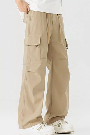 Men's tan cargo pants with multiple pockets and drawstring waist.