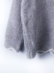 Gray acrylic knit sweater with scalloped trim detail on hem and cuffs.
