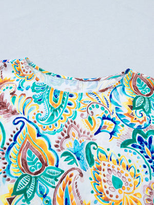Paisley floral puff sleeve shirt with crew neck in white with blue, yellow, and green watercolor print.