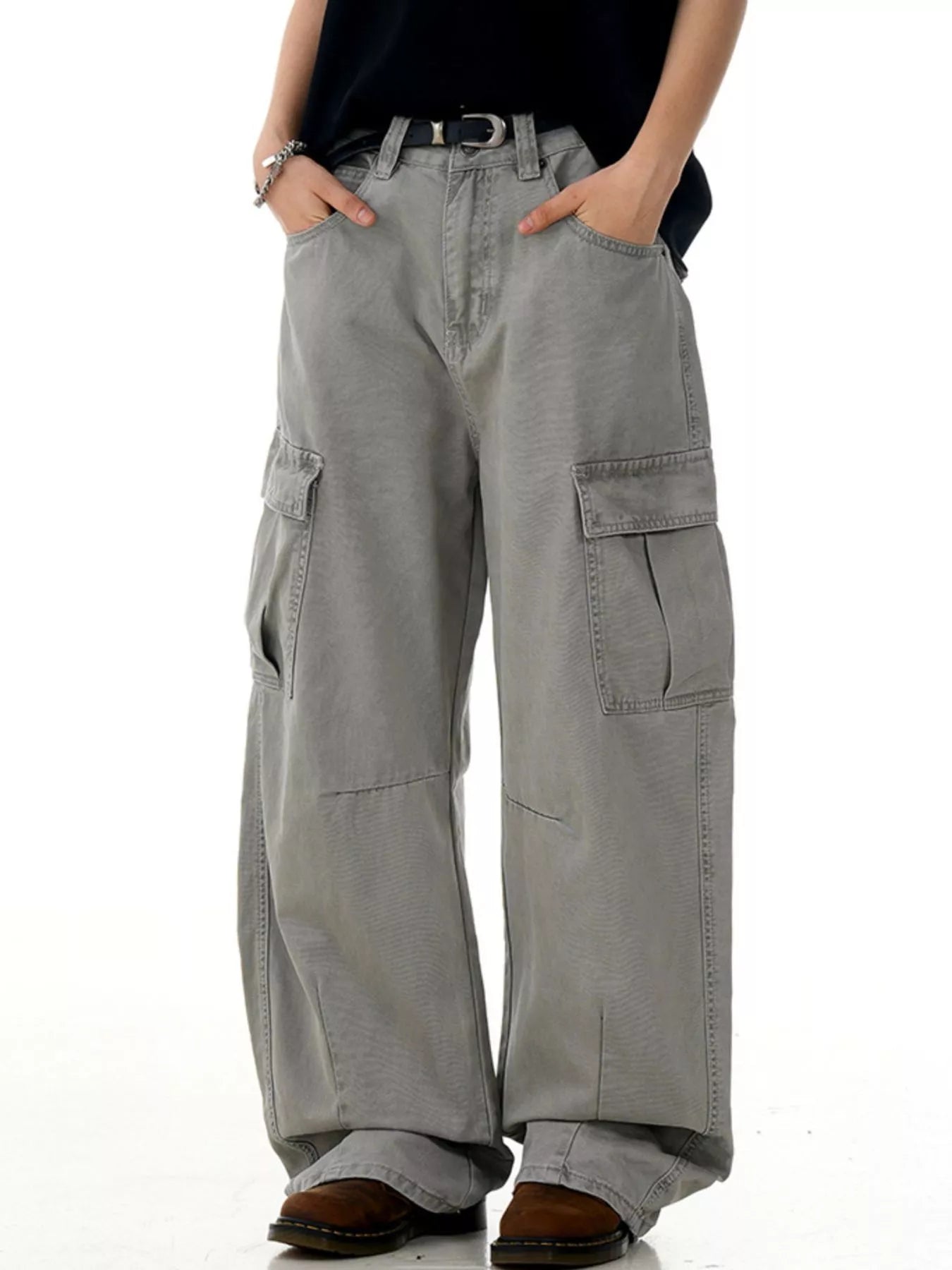 Men's grey vintage wide-leg cargo pants with multiple pockets and a relaxed fit.