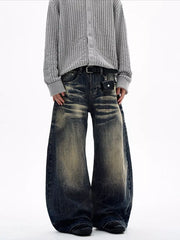Men's vintage wash wide leg jeans in dark blue denim with a distressed look.