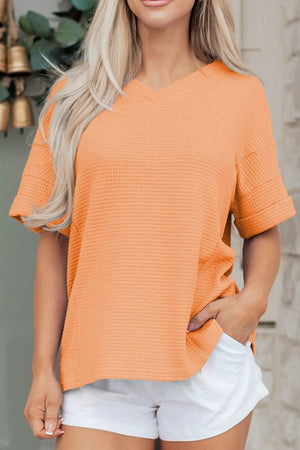 Sherbet waffle knit V-neck t-shirt with short sleeves and cuffed hem.