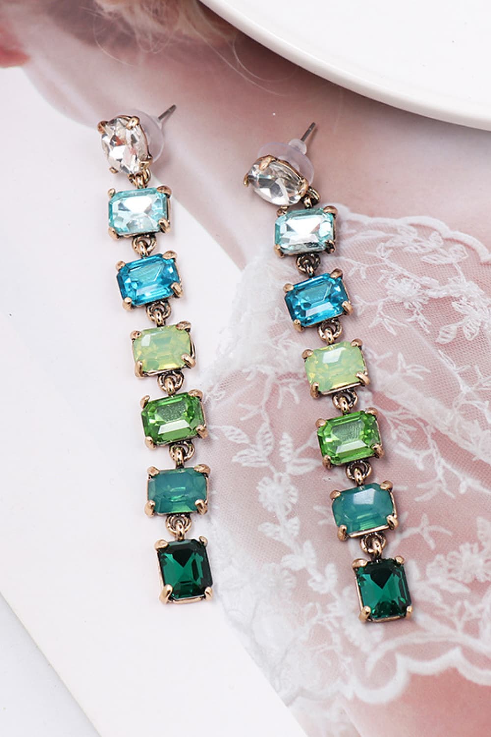 Ombre Gemstone Cascade Earrings with multicolor faceted stones and gold alloy setting.