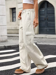 Khaki high-waisted cargo jeans with multiple pockets and a relaxed fit.