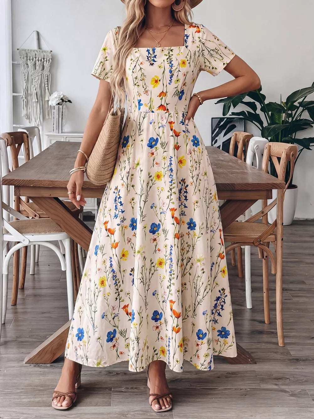 Wildflower A-line maxi dress with square neckline and short sleeves, featuring a floral print.