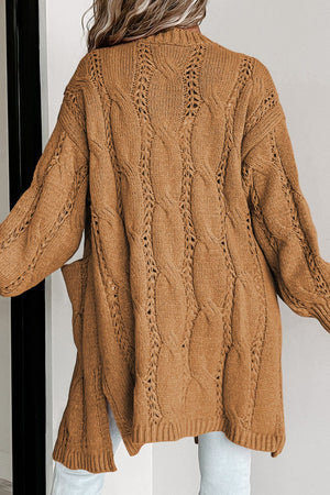 Camel cable knit open-front cardigan with pockets and openwork details.