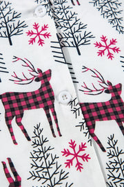 White pajama set with festive reindeer, snowflake, and tree print.
