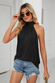 Black halter neck blouse with ruched detail and a bow-back detail.
