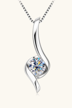 Silver moissanite pendant necklace with a sculpted swirl design.