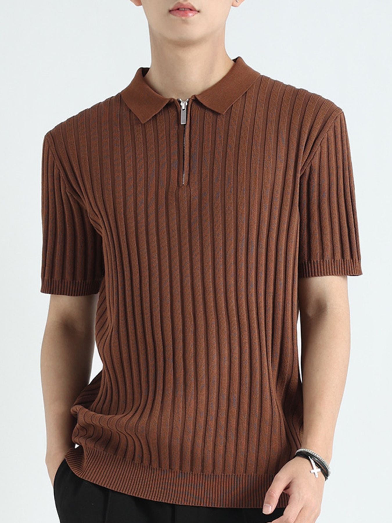 Brown ribbed knit polo shirt with short sleeves and a quarter zip neckline.