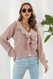 Dusty pink acrylic knit cardigan with ruffled collar and button front.