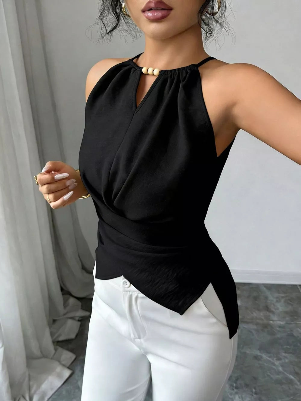 Black gathered neck cami with beaded detail and crisscross wrap front.