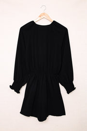 Black tie-front blouson sleeve playsuit with smocked cuffs and waist.