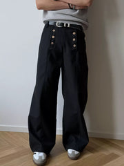 Black high-waisted wide leg pants with button detail and a belt.