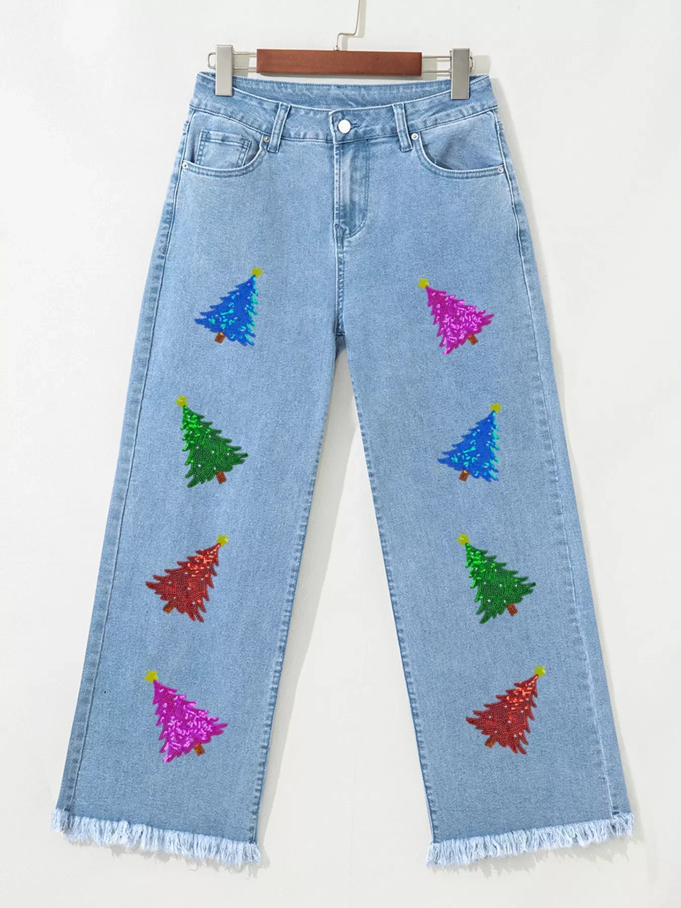 Medium wash cropped wide-leg jeans with sequin Christmas trees and frayed hem