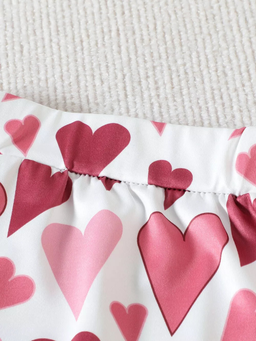 Baby shorts with pink and red heart print, elastic waist