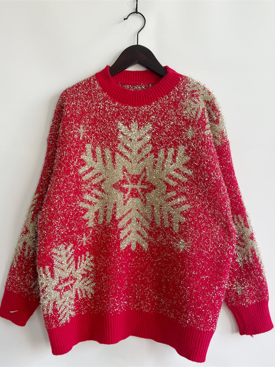 Red acrylic sweater with gold glitter snowflake pattern and crew neck.