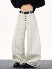 Relaxed fit wide leg button-fly jeans in off-white cotton with contrast stitching and a black belt.