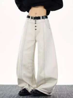 Relaxed fit wide leg button-fly jeans in off-white cotton with contrast stitching and a black belt.