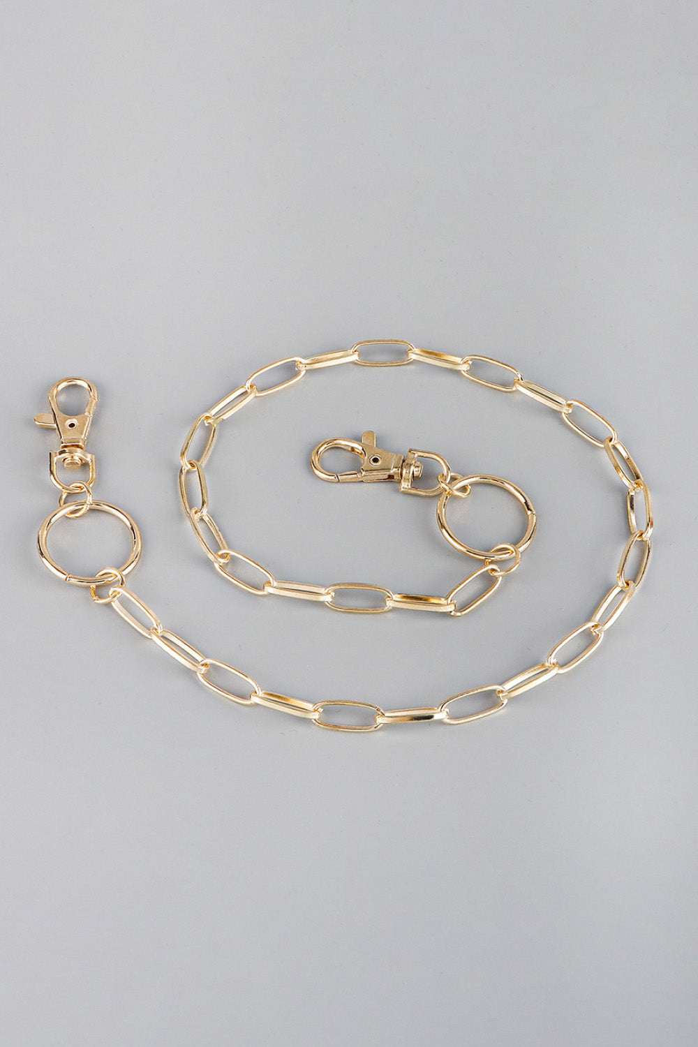 Gold chain wallet chain with two lobster clasps and a ring detail.
