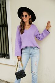 Lavender relaxed fit v-neck knit pullover sweater with ribbed cuffs and hem.